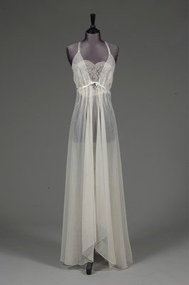 Lot 91 - An ivory chiffon nightdress, 1950s, with lace...