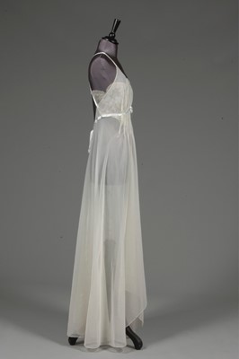 Lot 91 - An ivory chiffon nightdress, 1950s, with lace...
