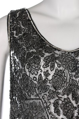 Lot 124 - A beaded lace flapper dress, late 1920s, with...