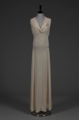 Lot 96 - An ivory crepe de chine nightdress embroidered...