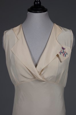 Lot 96 - An ivory crepe de chine nightdress embroidered...