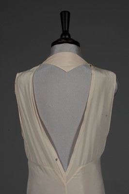 Lot 96 - An ivory crepe de chine nightdress embroidered...