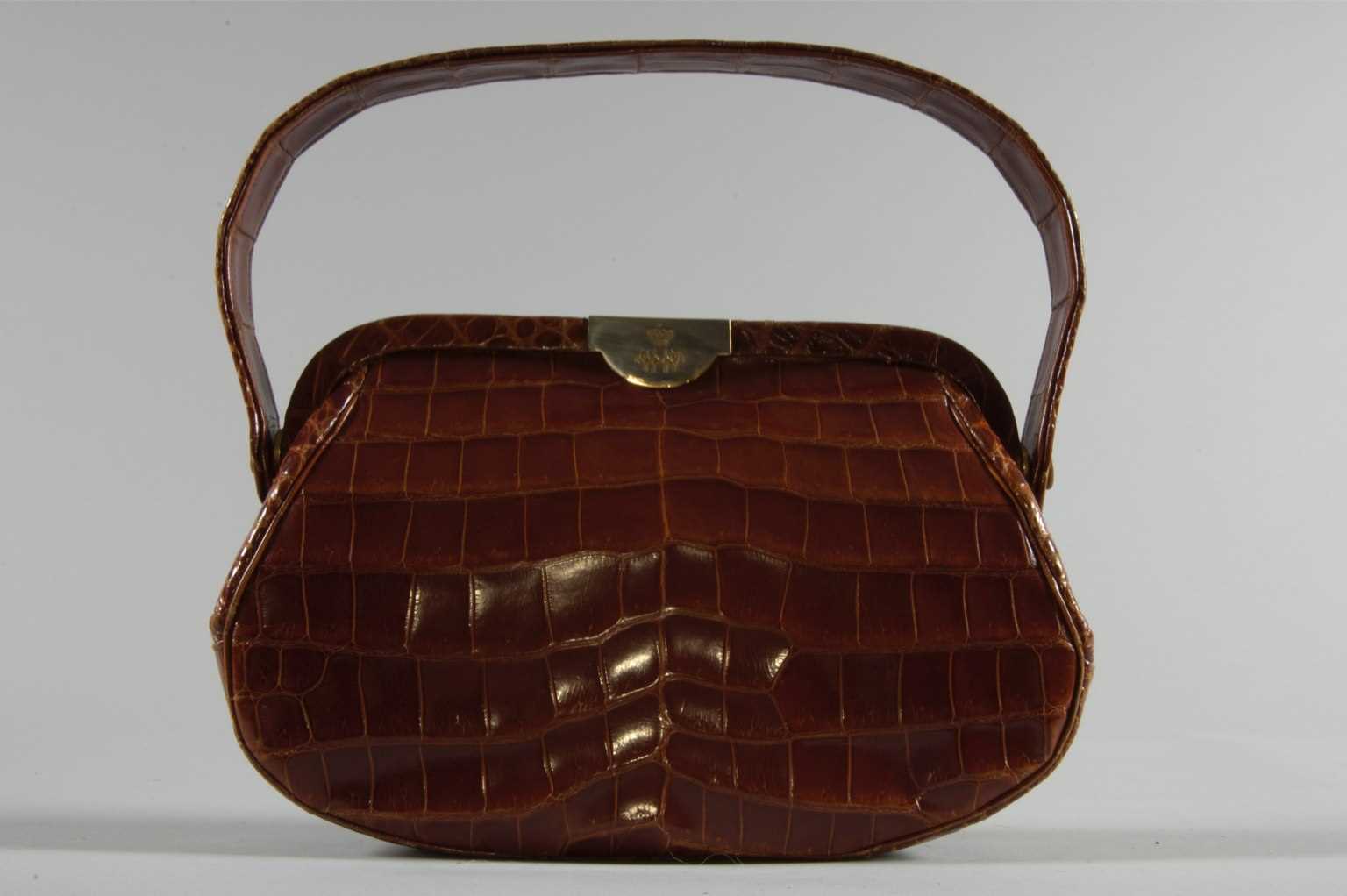 Lot 104 - An alligator handbag, bearing the cypher of...