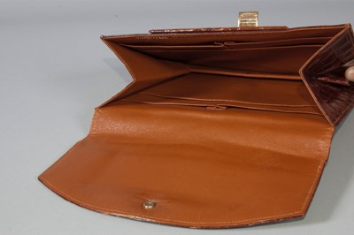 Lot 98 - A Cartier alligator clutch bag, circa 1938-40,...