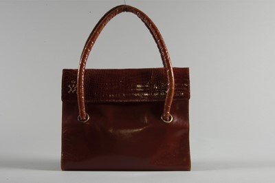 Lot 94 - A brown calf and alligator handbag bearing the...