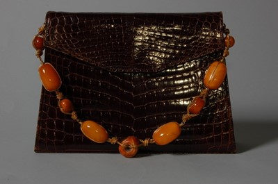 Lot 100 - A Christian Dior brown alligator handbag,...