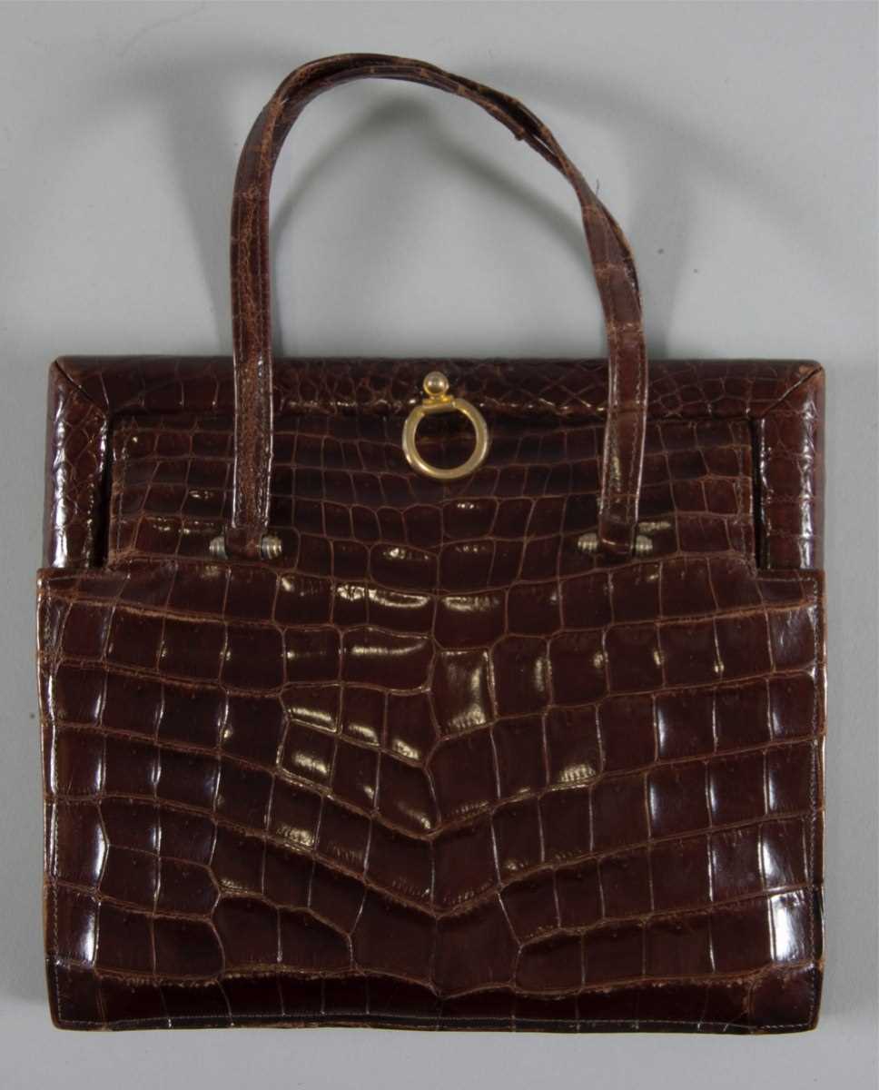 Lot 92 - A brown alligator handbag, circa 1947-50,...