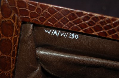 Lot 92 - A brown alligator handbag, circa 1947-50,...