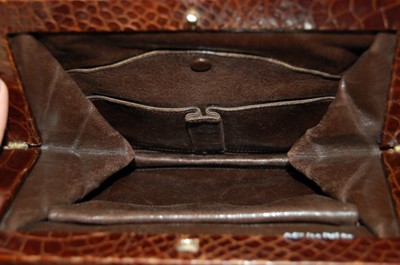 Lot 92 - A brown alligator handbag, circa 1947-50,...