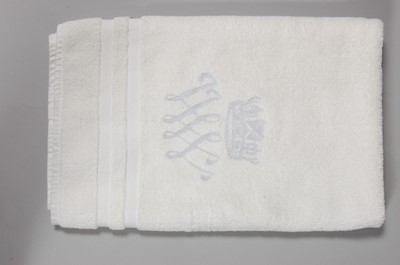 Lot 119 - Three hand towels and a bath mat bearing the...