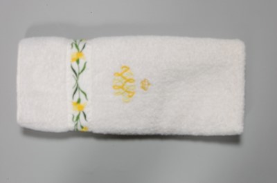 Lot 119 - Three hand towels and a bath mat bearing the...