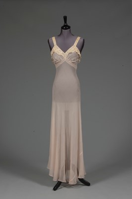 Lot 90 - A pale pink chiffon nightdress, circa 1935-40,...