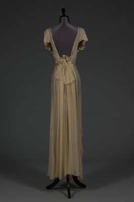 Lot 87 - A lemon chiffon nightdress, late 1930s-mid...