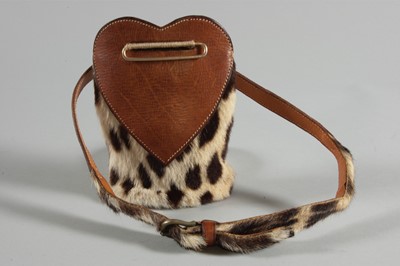 Lot 117 - A rare Schiaparelli waist pouch, 'boutique des...
