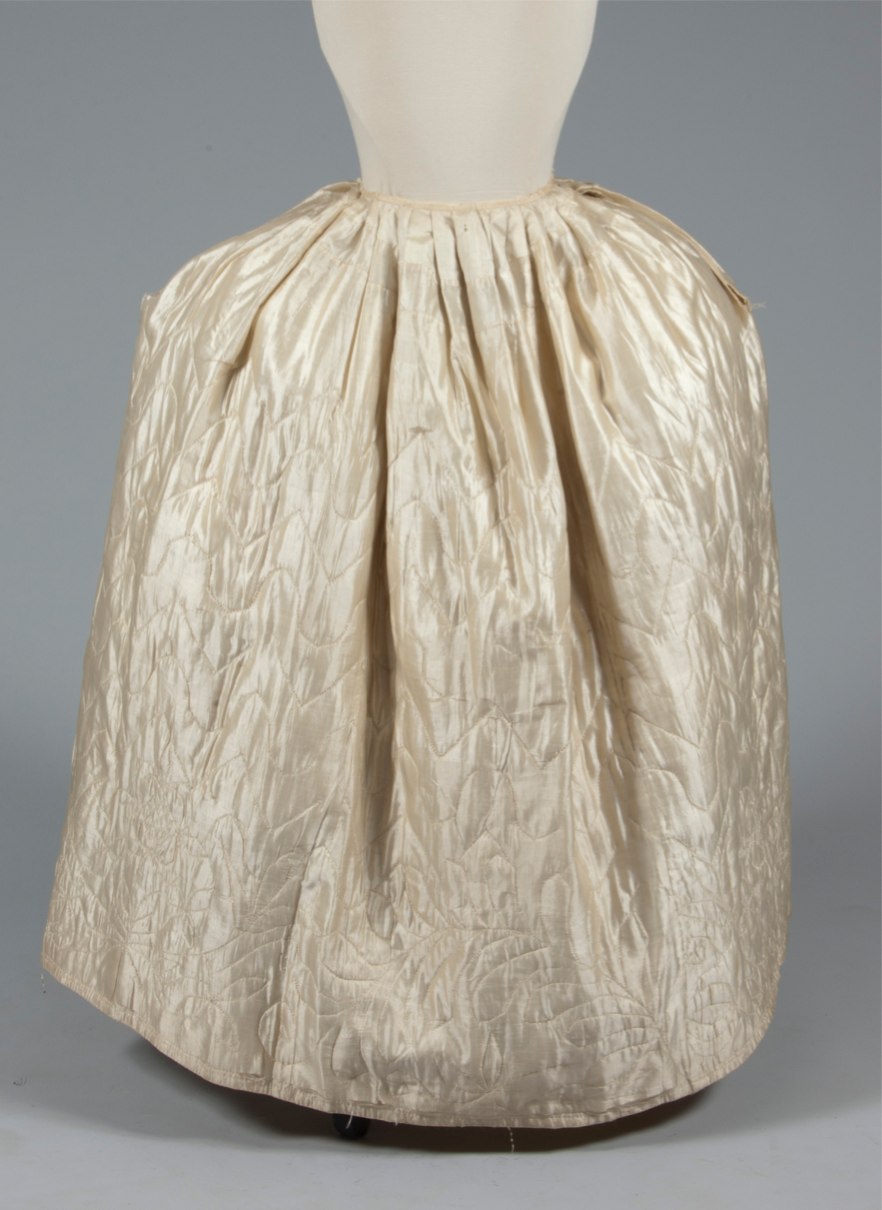 Lot 49 - A quilted ivory silk petticoat, circa 1760-80,