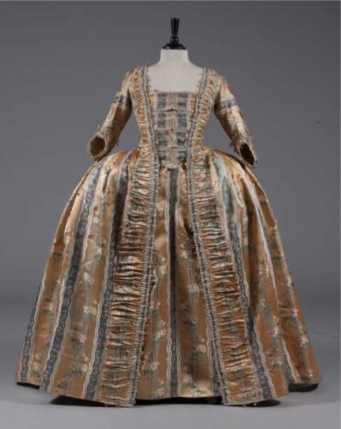 Click for high resolution Lot 40 - A brocaded apricot robe à la française, circa...