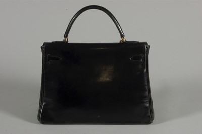 Lot 7 - An Hermès black leather Kelly bag, circa 1960,...