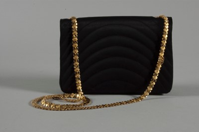Lot 9 - A Chanel quilted satin evening bag, 1980s,...