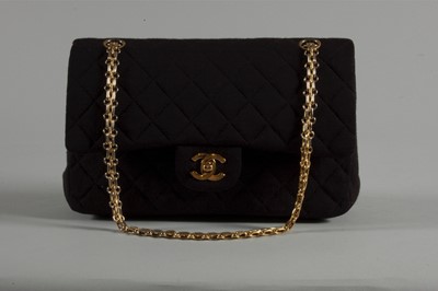 Lot 6 - A Chanel quilted black jersey 2.55 bag, 1980s,...