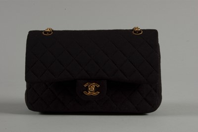 Lot 6 - A Chanel quilted black jersey 2.55 bag, 1980s,...