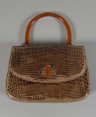 Lot 8 - A Gucci cafau lait crocodile handbag, 1960s,...