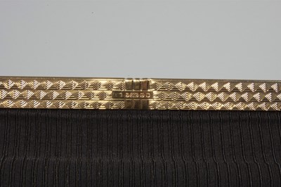 Lot 16 - A Cartier gold mounted black silk grosgrain...
