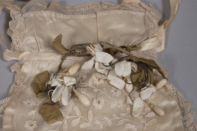 Lot 56 - An ivory silk bridal gown, circa 1838, with...