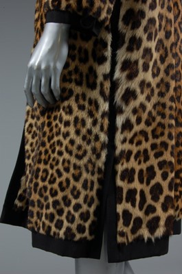 Lot 178 - A leopard skin coat, circa 1965, with black...