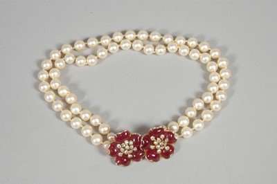 Lot 14 - A faux pearl double strand necklace and...