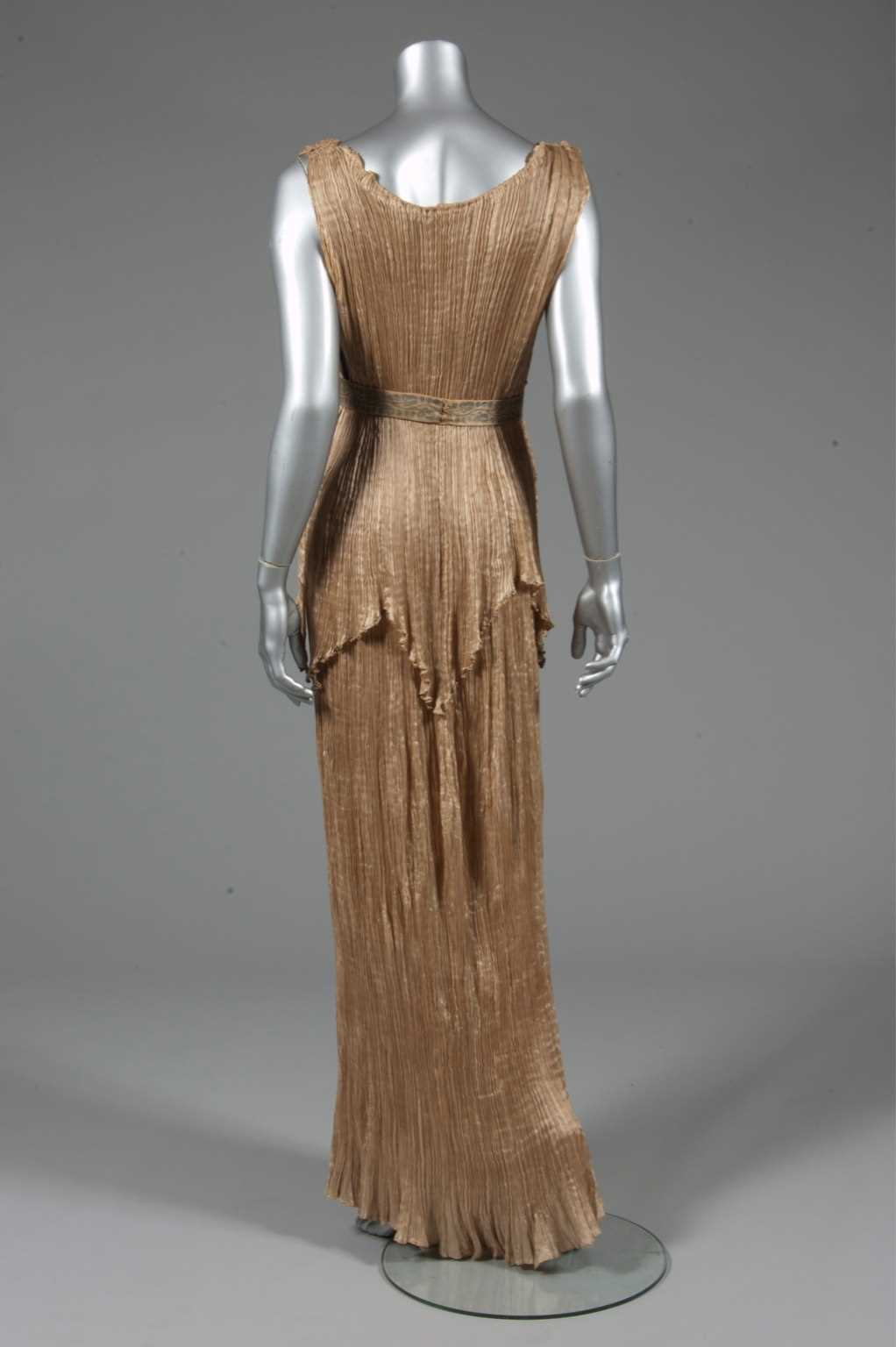 Lot 73 - A Mariano Fortuny apricot silk Peplos gown,