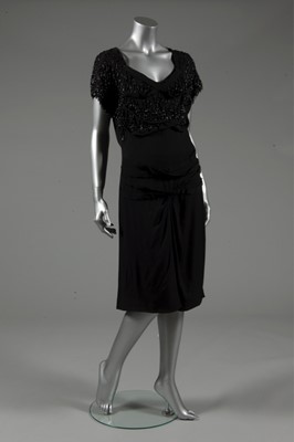 Lot 124 - A Gilbert Adrian beaded black wool crepe...