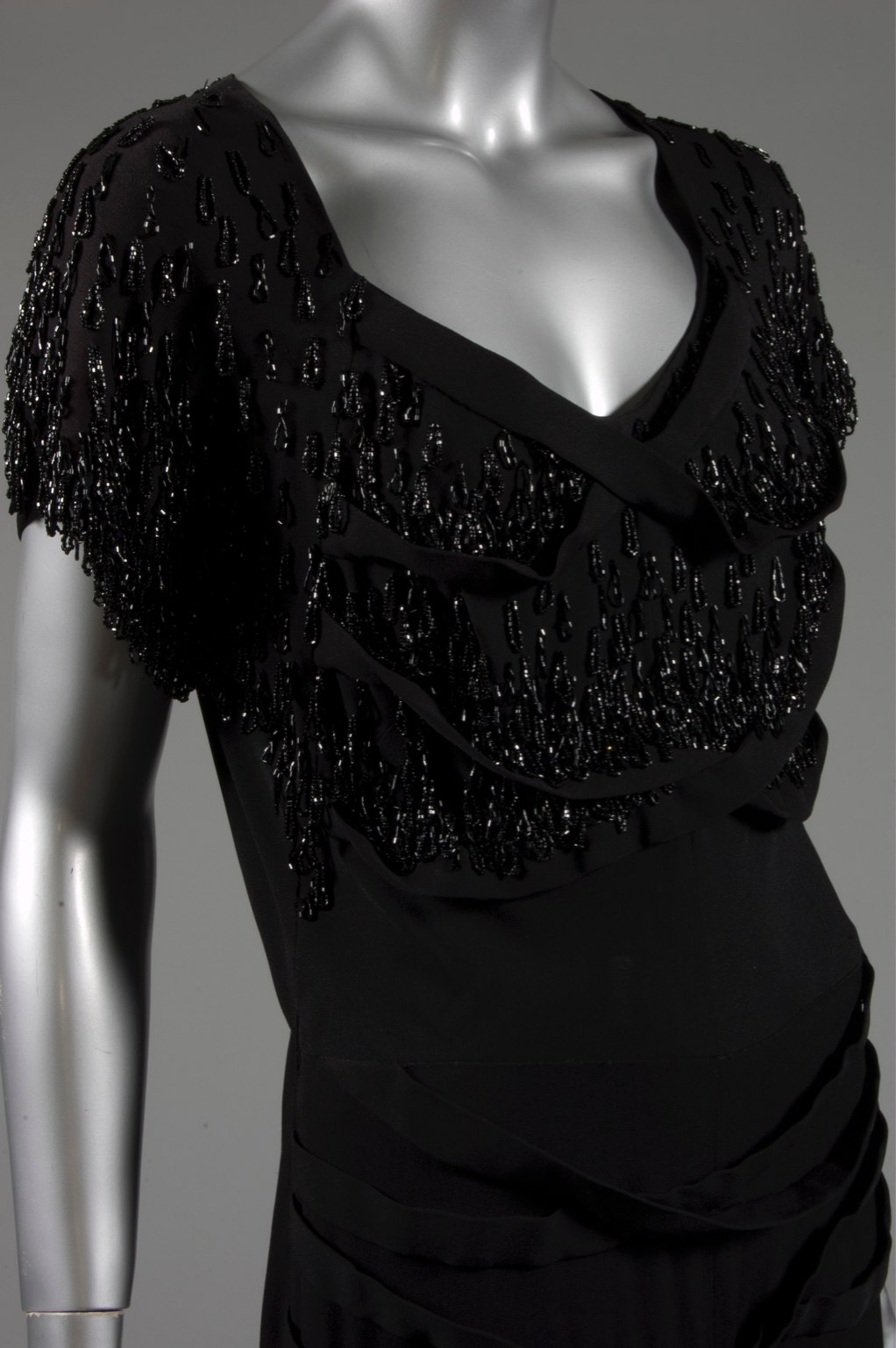Lot 124 A Gilbert Adrian beaded black wool crepe