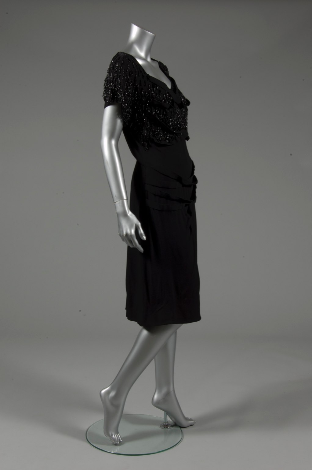 Lot 124 A Gilbert Adrian beaded black wool crepe