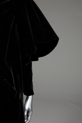 Lot 81 - A Balenciaga couture black velvet redingote,...