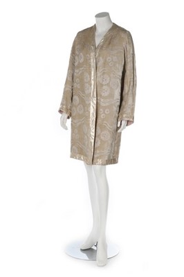 Lot 162 - An ivory and silver voided velvet evening coat,...