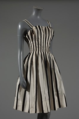Lot 128 - A Pierre Balmain couture black satin and ivory...