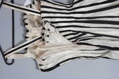 Lot 128 - A Pierre Balmain couture black satin and ivory...