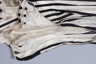 Lot 128 - A Pierre Balmain couture black satin and ivory...