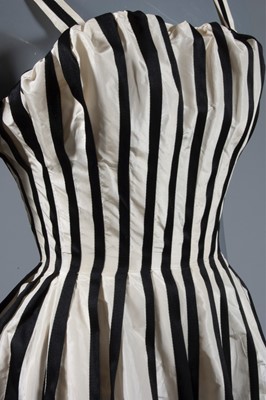 Lot 128 - A Pierre Balmain couture black satin and ivory...