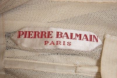 Lot 128 - A Pierre Balmain couture black satin and ivory...