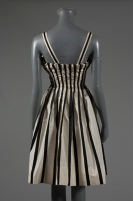Lot 128 - A Pierre Balmain couture black satin and ivory...