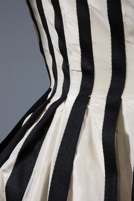 Lot 128 - A Pierre Balmain couture black satin and ivory...