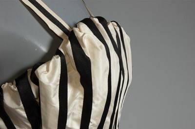 Lot 128 - A Pierre Balmain couture black satin and ivory...