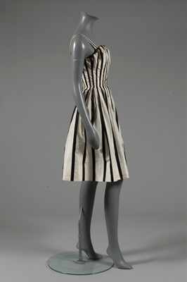 Lot 128 - A Pierre Balmain couture black satin and ivory...