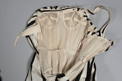 Lot 128 - A Pierre Balmain couture black satin and ivory...