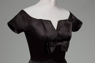 Lot 121 - A fine Jacques Heim couture black satin...