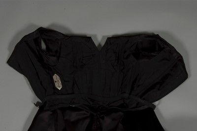 Lot 121 - A fine Jacques Heim couture black satin...