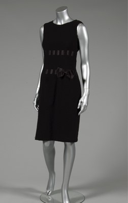 Lot 137 - A Pierre Balmain black bouclé wool dinner gown,...