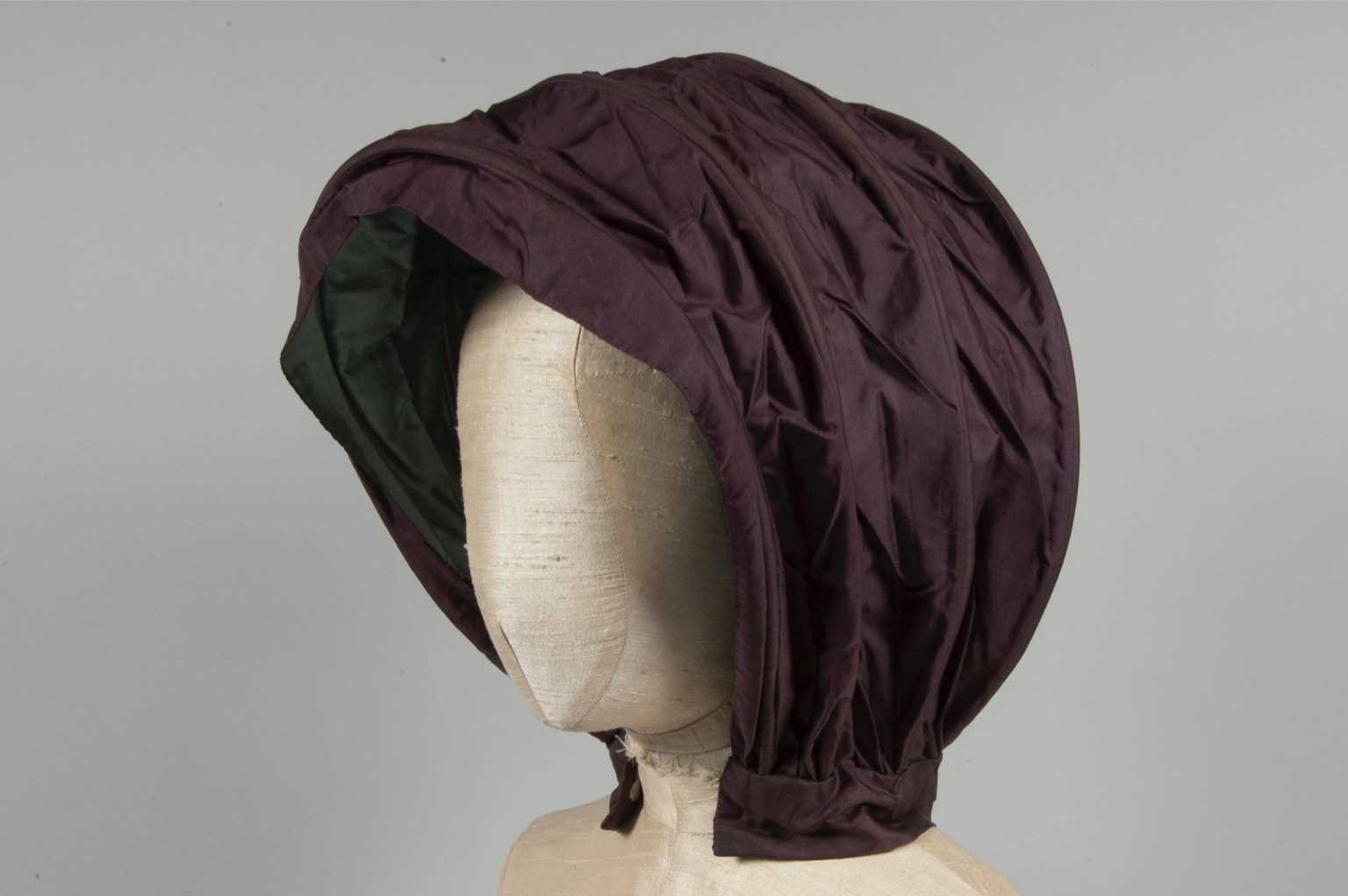 Lot 32 - A purple silk caleche bonnet, late 18th...