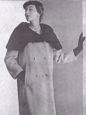 Lot 134 - A Balenciaga couture black wool suit with fur...